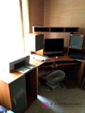 Computer desk with content including printer, fan, monitor, and more