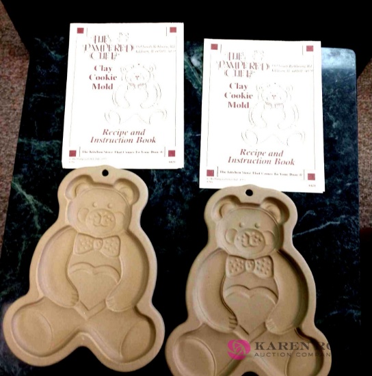 Two pampered Chef clay cookie molds