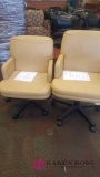 Two tan computer chairs