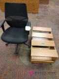 Two tables on wheels and office chair