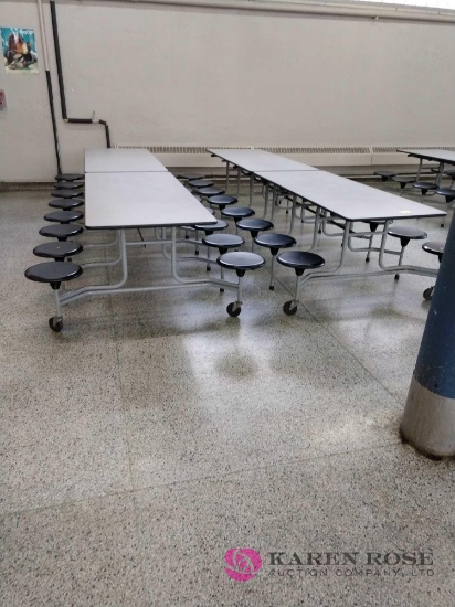 Two 12 foot folding cafeteria tables with seats