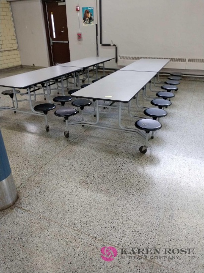 Two 12 foot folding cafeteria tables with seats