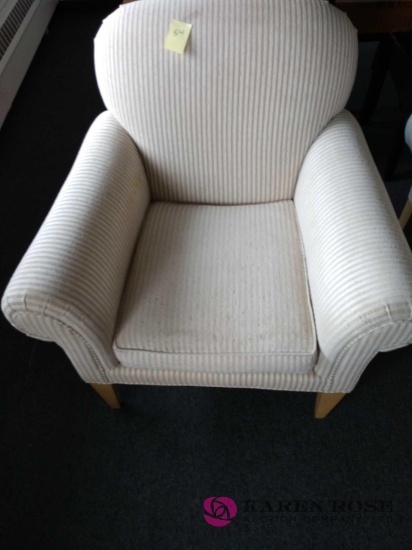Cushioned armchair