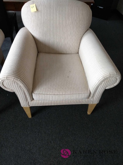 Cushioned armchair