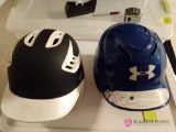 Two batting helmets one Rawlings and one under armour