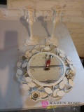 Metal mirror 14 in in diameter and two metal candlestick holders