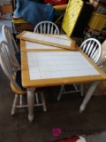 Tiled dining table with four chairs c1