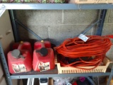 Two extension cords and two gas cans