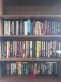 3 shelves of books. Dr. Phil, Grisham, and killerman
