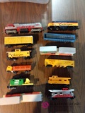 Assorted HO train cars in engines