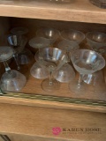 Shelf of clear glass stemware