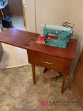 White sewing machine with sewing table