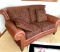 Brown leather loveseat