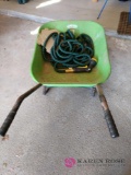 Wheelbarrow and garden hose