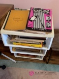 Three tier cart full of books of music