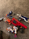 Five Nerf guns with bullets