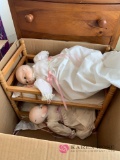 Vintage porcelain dolls in wooden bunk bed