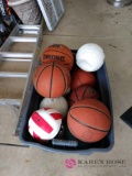 Tub of basketball base balls, and volleyballs