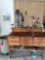 Workbench in garage with contents including back wall