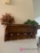 Wooden coat rack and artificial flowers