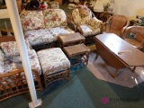 9 piece wicker furniture lot with wood table in basement