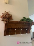 Wooden coat rack and artificial flowers