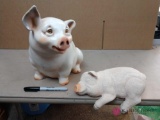 2 decorative pig figurines one is musical