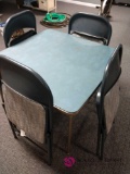 Card table with four folding chairs