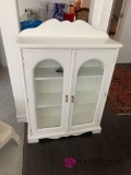 White cabinet with glass doors