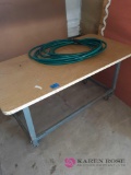 Work table on Wheels and garden hose