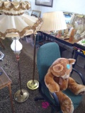 Large teddy bear, rolling office chair and two floor lamps