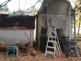 Ladders, trellises, garden hose and miscellaneous behind shed