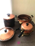 4- pieces Copper Clad pans and serving ware