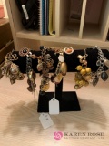 Six costume jewelry charm bracelets