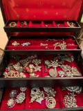 Jewelry box with vintage rhinestone and beaded brooches