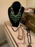 Six costume jewelry necklaces