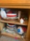 Kitchen cabinet contents paper plates dishes salt pepper shakers