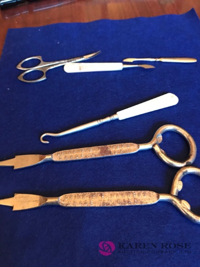 Lot of vintage scissors and advertising bottle openers