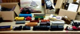 H o train set. Includes four locomotives, rail cars, track, buildings, and transformers