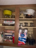 Contents of the cabinet above the microwave back entryway