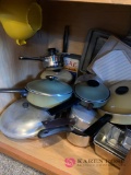 Kitchen cabinet of pots and pans cookie sheets and miscellaneous