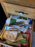 Kitchen drawer of potholders and miscellaneous