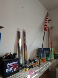 Miscellaneous lot including flag, driveway markers, battery, garden hose, and more