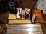 Miscellaneous light including coin holders and slide rules and scale.b4