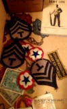 World war II military uniform including hats and patches.b1