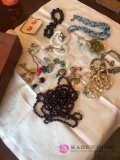 Box of costume jewelry earrings and necklaces