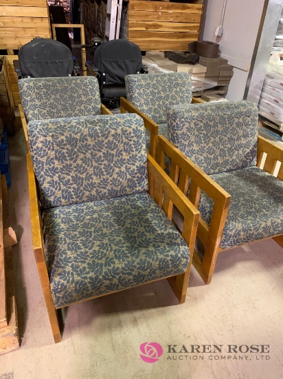 Four matching wooden chairs with cushions