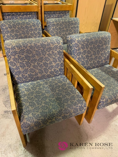 Four matching wooden chairs with cushions