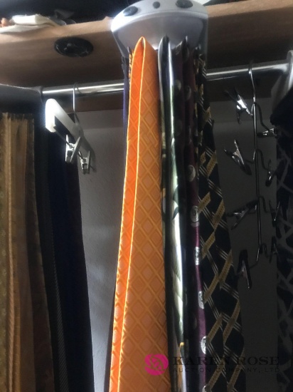 Rotating tie rack with designer ties