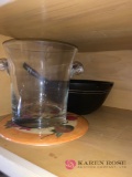 Contents of shelf above fridge glass ice bowl containers and miscellaneous